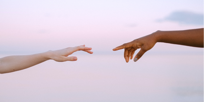 coming together two hands meeting